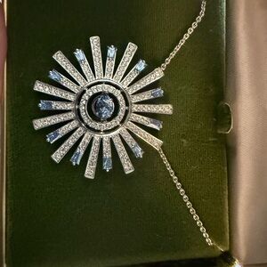Elegant Silver Sunburst Pendant Necklace